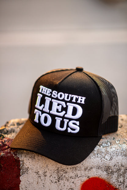 THE SOUTH LIED TO US - Trucker Cap